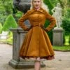 Caroline Swing Coat In Ochre Brown By Hearts & Roses London