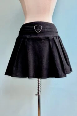 Black Pleated Denim Mini Skirt With A Heart Buckle By Jawbreaker