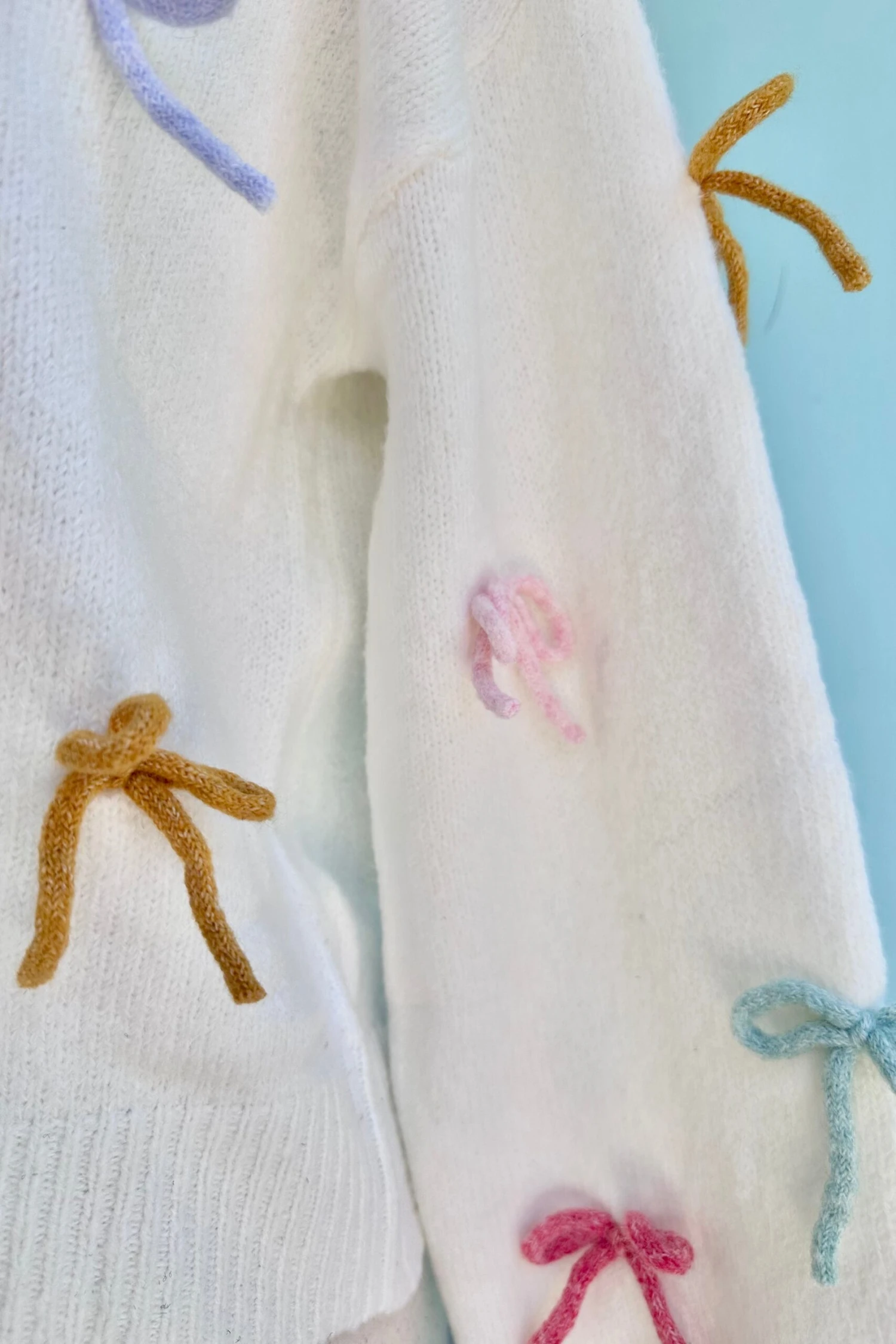 All Over Bow Knit Sweater in Ivory All Over Bow Knit Sweater In Ivory -MODERN MILLIE Shop 46383268 7BB0 4DA7 AA04 02D4A9874570 scaled