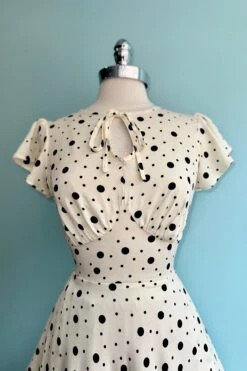 Cream And Black Polka Dot Flutter Sleeve Dress By Voodoo Vixen 7 Cream And Black Polka Dot Flutter Sleeve Dress By Voodoo Vixen -MODERN MILLIE Shop 60F18251 F2AC 4587 BE3D 9E47AF8C2109