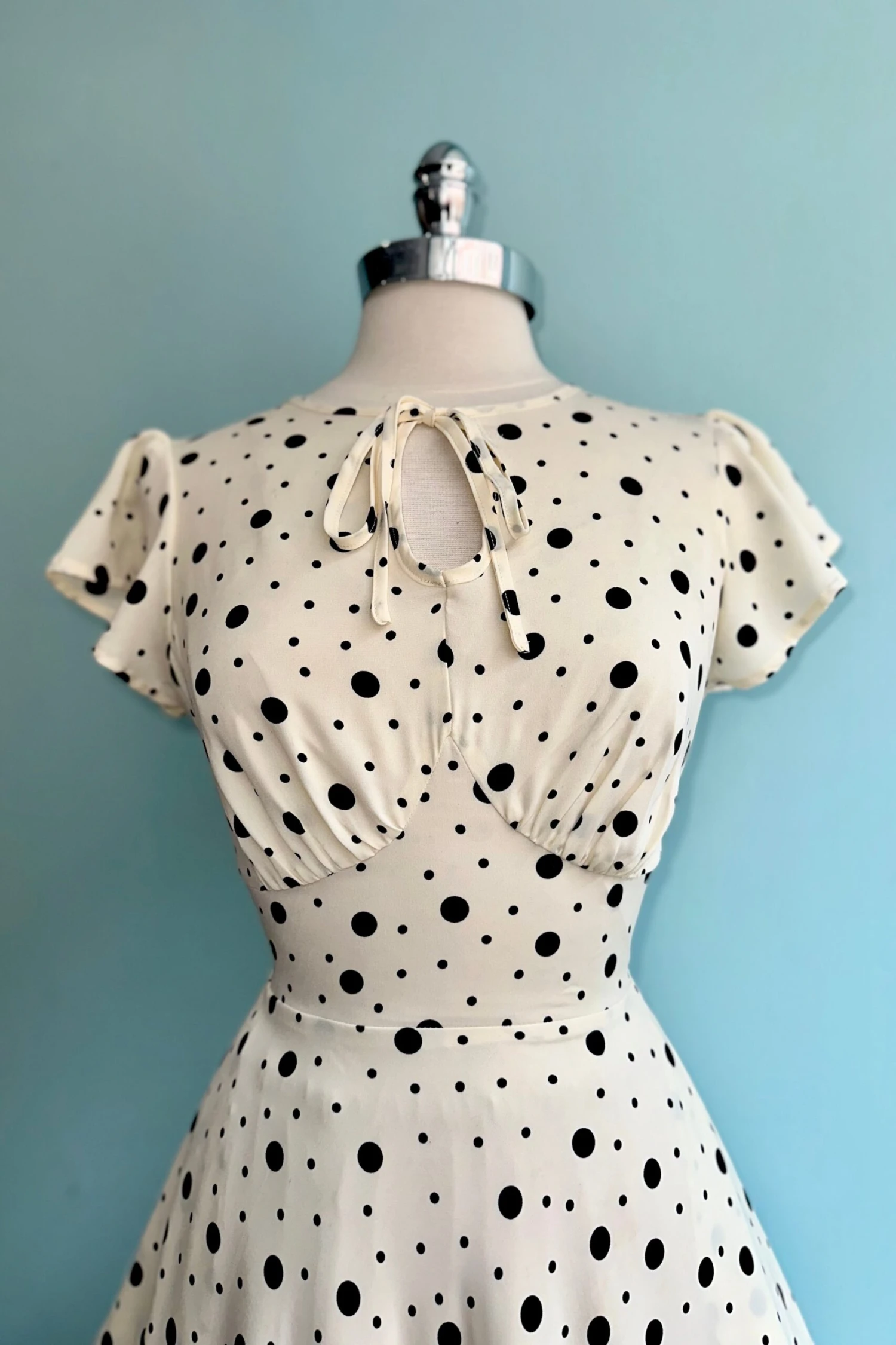 Cream and Black Polka Dot Flutter Sleeve Dress by Voodoo Vixen Cream And Black Polka Dot Flutter Sleeve Dress By Voodoo Vixen -MODERN MILLIE Shop 60F18251 F2AC 4587 BE3D 9E47AF8C2109 scaled