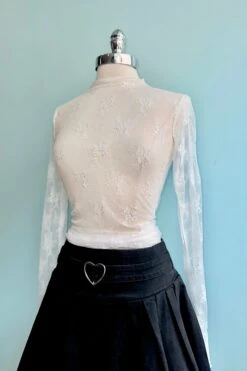 Off-White Mesh Long Sleeve Mock Neck Sheer Top -MODERN MILLIE Shop 71AF1AF2 36BE 4EDC B1B8 9297E16302C6