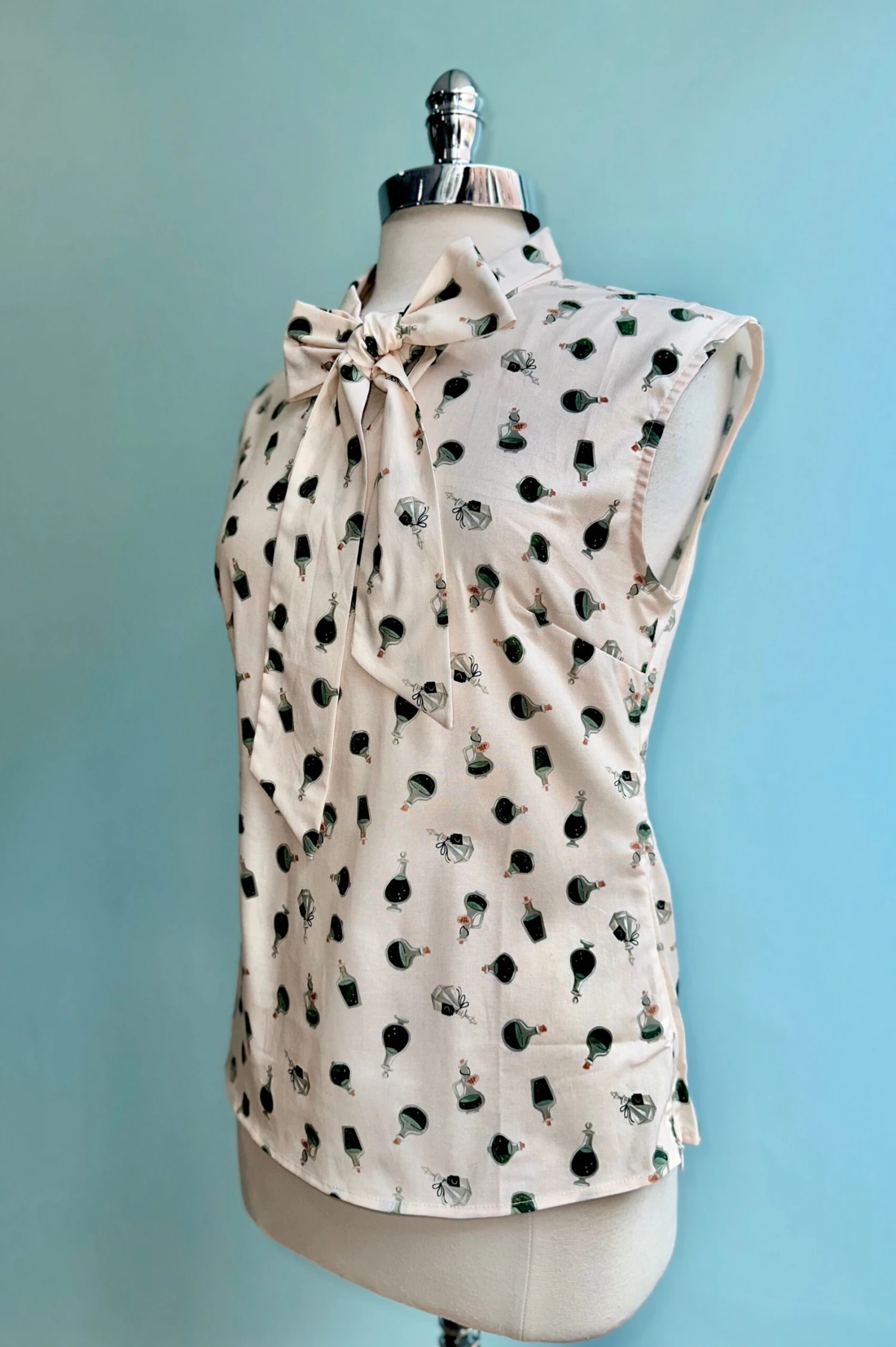 Potion Bottle Bow Top by Retrolicious Potion Bottle Bow Top By Retrolicious -MODERN MILLIE Shop 7533B475 EB43 4860 BA57 4745E6F05E88 scaled