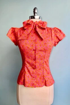 Orange And Pink Mod Daisy Estelle Tie-Neck Blouse By Heart Of Haute