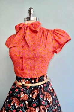 Orange And Pink Mod Daisy Estelle Tie-Neck Blouse By Heart Of Haute -MODERN MILLIE Shop D5702E7D E7BB 4304 BE68 B076632D61C2
