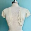 Ivory Cropped Bolero Sweater By Tulip B. -MODERN MILLIE Shop E4EC22CE EE55 4E58 8351 13A1ED6E33B8