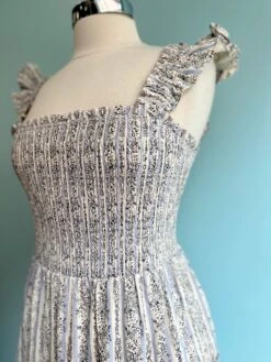 Floral And Striped Smocked Ruffle Sleeve Midi Dress 11 Floral And Striped Smocked Ruffle Sleeve Midi Dress -MODERN MILLIE Shop FEE24C63 25B0 4385 A45A D670335C9759