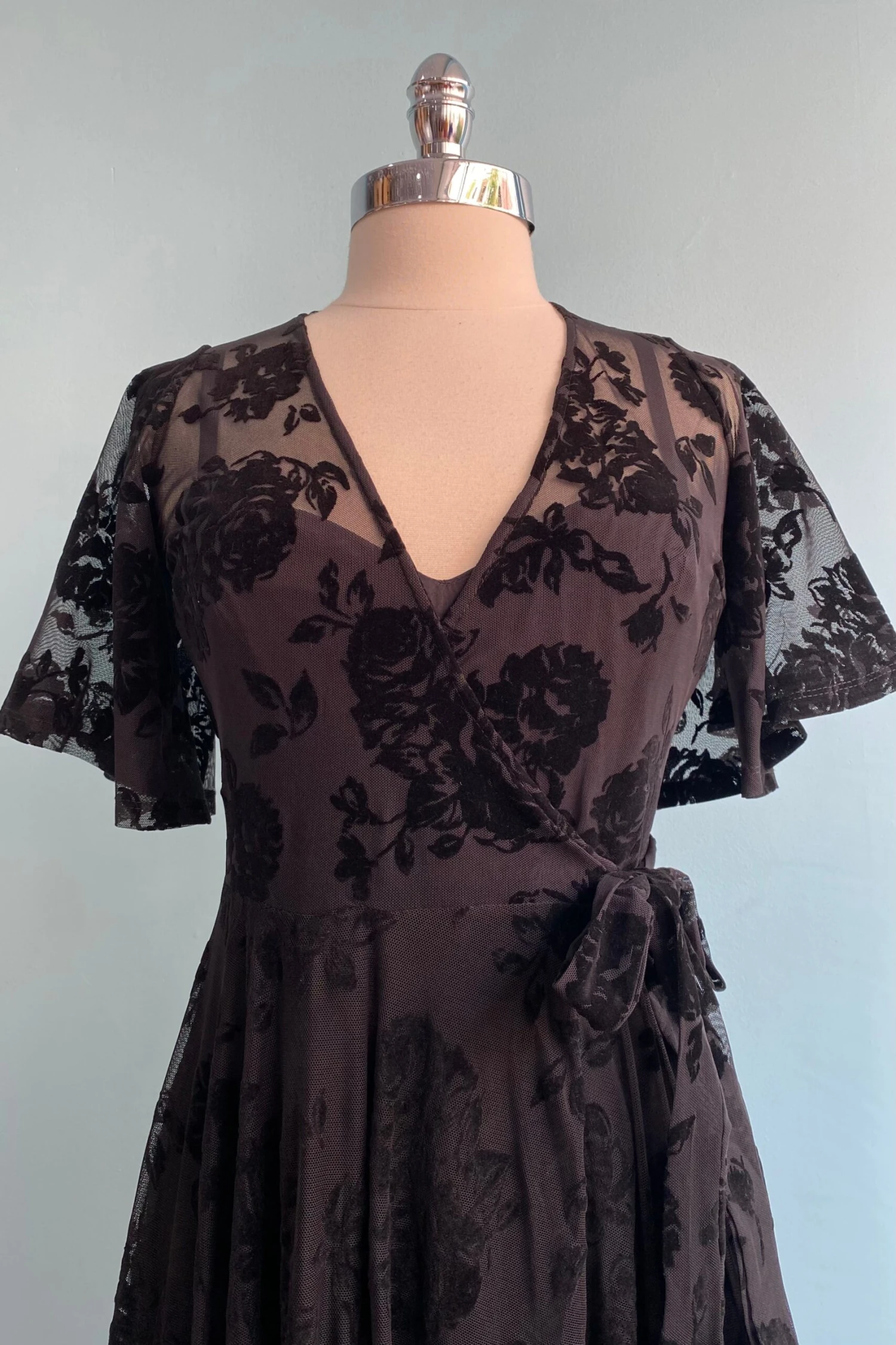 Lydia Wrap Dress in Black Flocked Rose Mesh by Wax Poetic Lydia Wrap Dress In Black Flocked Rose Mesh By Wax Poetic -MODERN MILLIE Shop image 0afd6658 1f95 4687 b843 a4d38878fc66 scaled