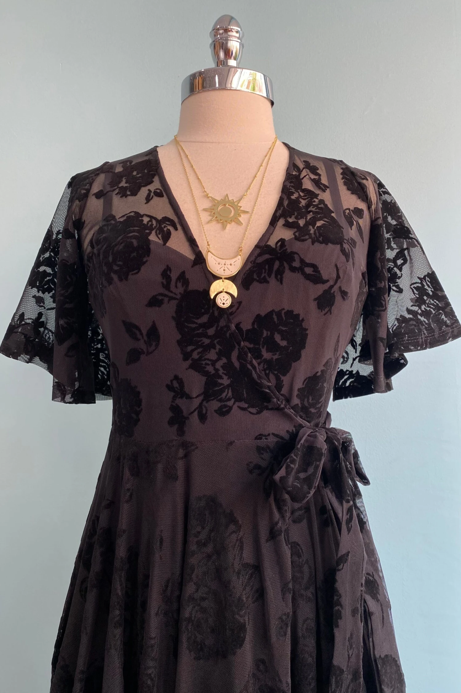 Lydia Wrap Dress in Black Flocked Rose Mesh by Wax Poetic Lydia Wrap Dress In Black Flocked Rose Mesh By Wax Poetic -MODERN MILLIE Shop image 380242b6 9cc9 4155 9e6d 1995a06f5b05 scaled