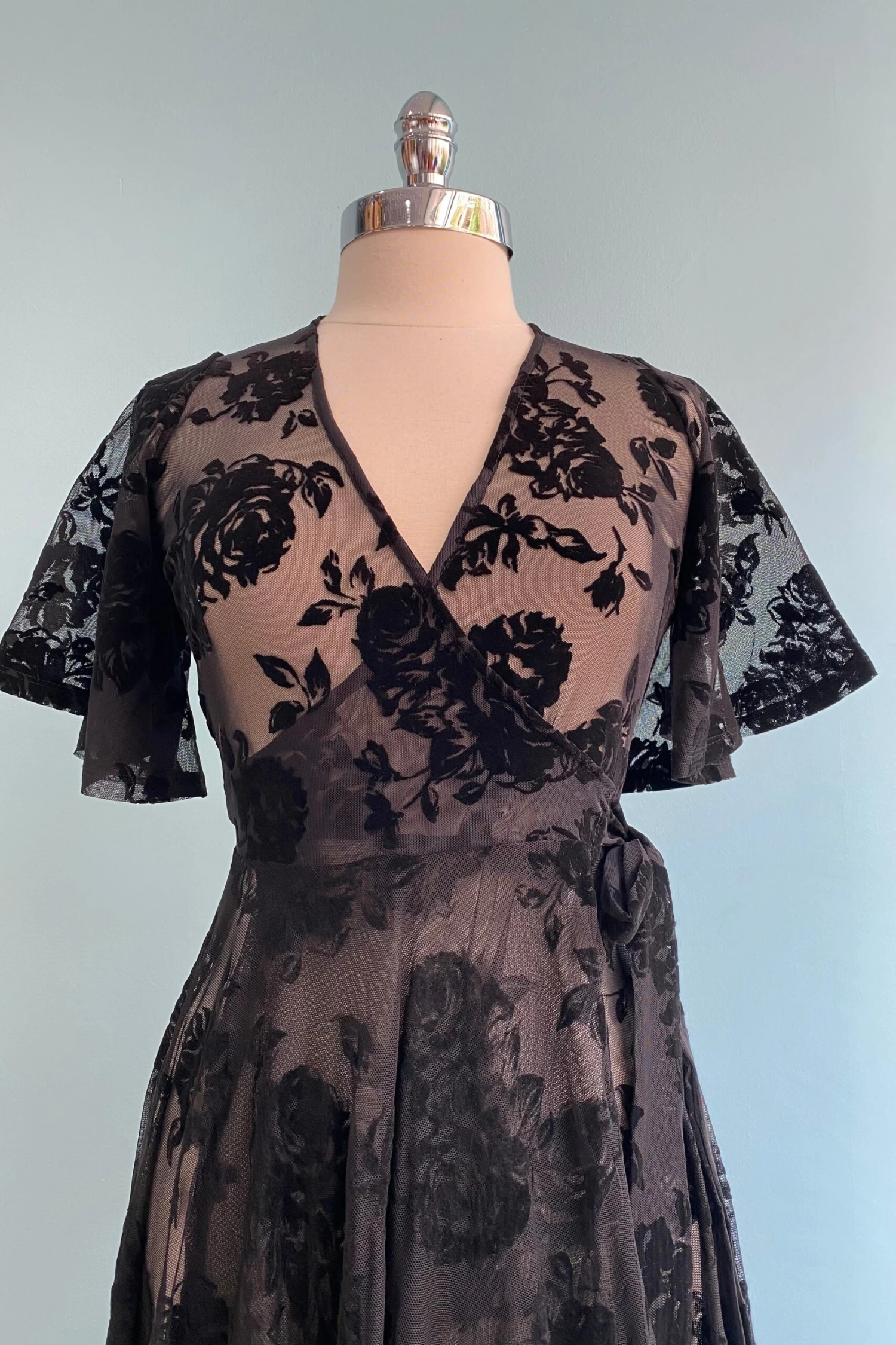 Lydia Wrap Dress in Black Flocked Rose Mesh by Wax Poetic Lydia Wrap Dress In Black Flocked Rose Mesh By Wax Poetic -MODERN MILLIE Shop image 3b12a7df 6981 4276 bb13 7b01a9e33964 scaled