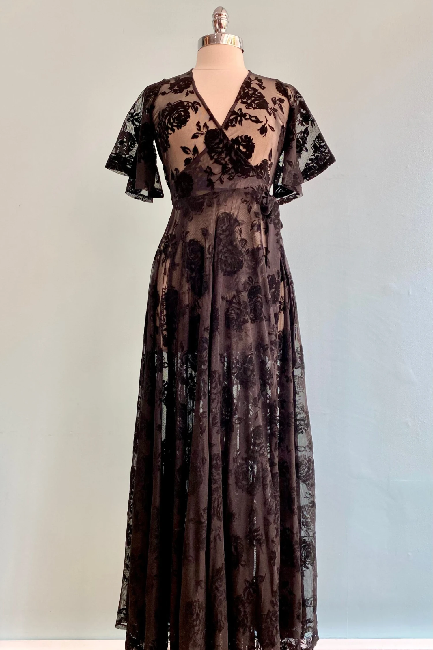 Lydia Wrap Dress in Black Flocked Rose Mesh by Wax Poetic Lydia Wrap Dress In Black Flocked Rose Mesh By Wax Poetic -MODERN MILLIE Shop image b32a3cee 0264 4b0d bd97 f1879ec61f88 scaled