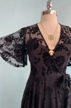Lydia Wrap Dress In Black Flocked Rose Mesh By Wax Poetic 6 Lydia Wrap Dress In Black Flocked Rose Mesh By Wax Poetic -MODERN MILLIE Shop image fcda86a9 3632 4b95 9828 a81c29a0876a