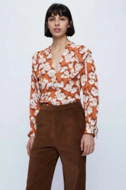 Peach Floral Ruffle Shoulder Top By Wild Pony 7 Peach Floral Ruffle Shoulder Top By Wild Pony -MODERN MILLIE Shop long sleeved top with floral print 1